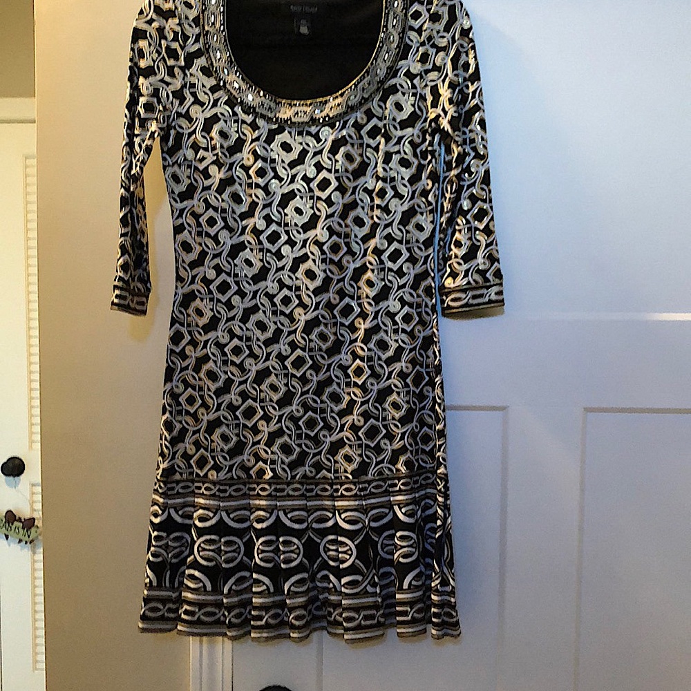 Gorgeous dress. Only worn once.Gold,blak and wht. Beautifully pleated at bottom.